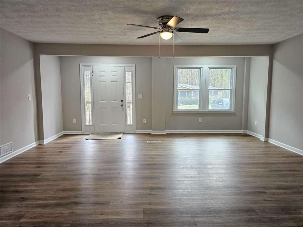 6470 Michell Way Douglasville, GA 30135 - Photo 8 of 41 a view of empty room with wooden floor and fan