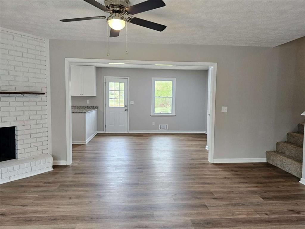 6470 Michell Way Douglasville, GA 30135 - Photo 10 of 41 wooden floor in an empty room with a window