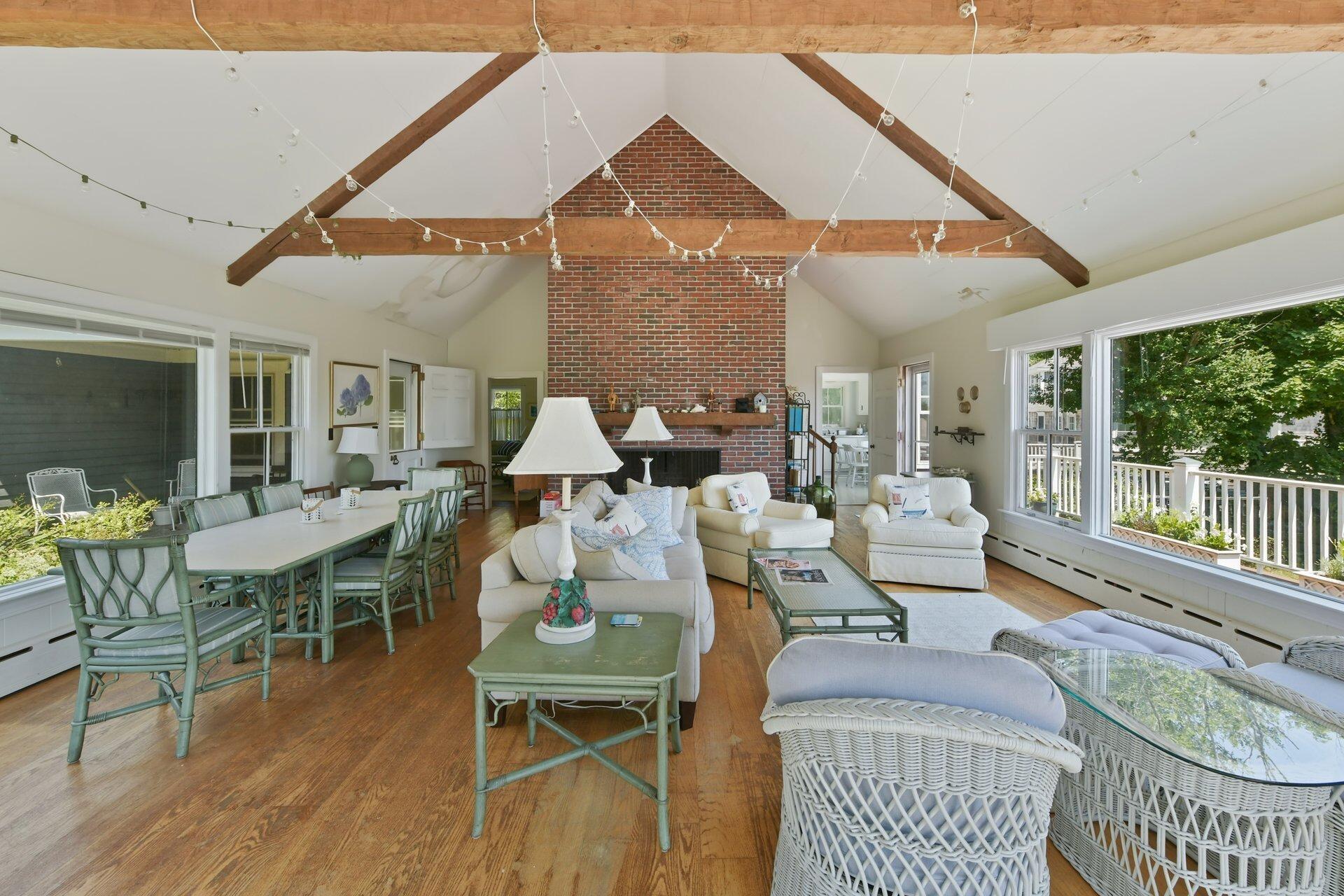 916 Main Street Cotuit, MA 02635 - Photo 12 of 22 a dining room with furniture window and wooden floor