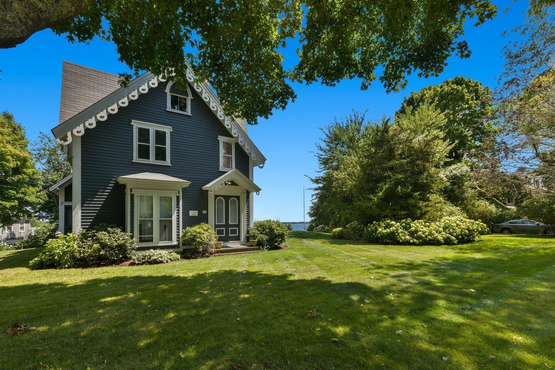 916 Main Street Cotuit, MA 02635 - Photo 16 of 22 a front view of house with yard and green space