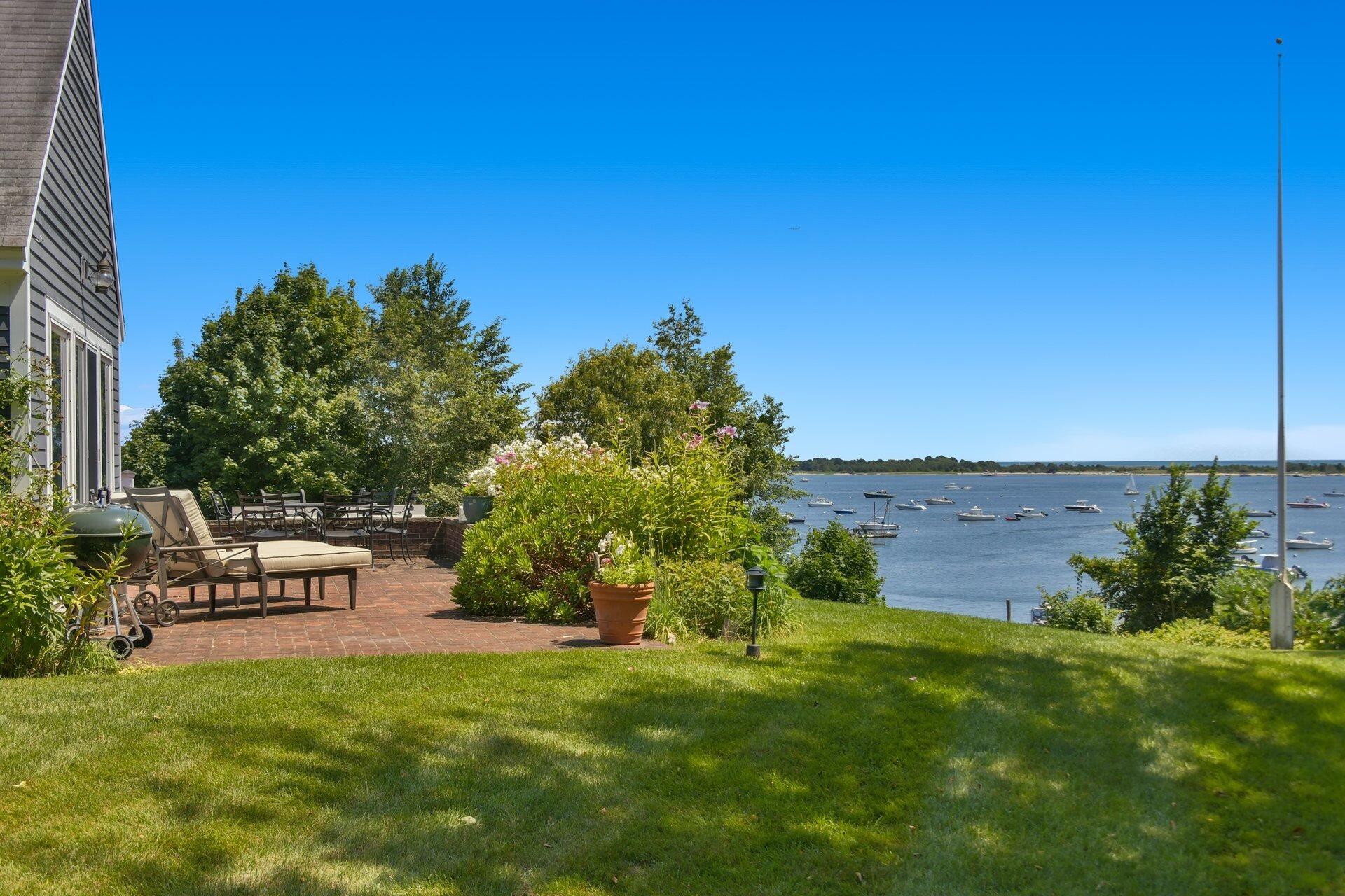 916 Main Street Cotuit, MA 02635 - Photo 17 of 22 a view of a garden with lawn chairs