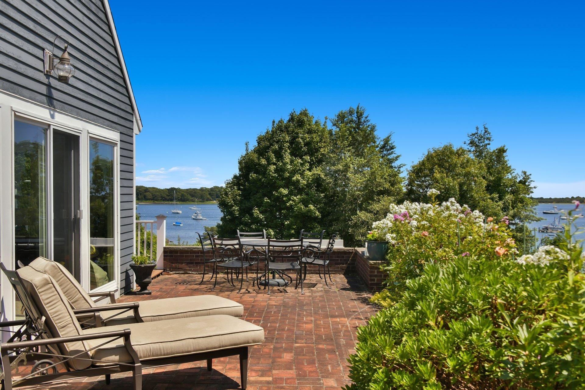 916 Main Street Cotuit, MA 02635 - Photo 18 of 22 a view of backyard with seating area and green space