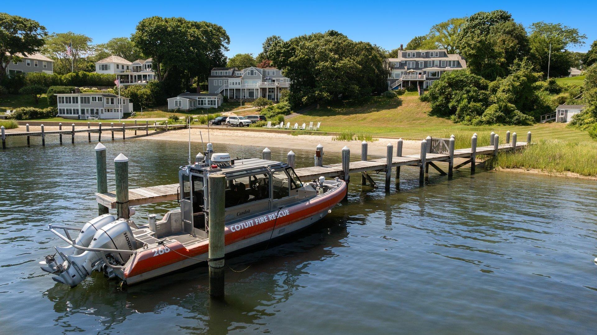 916 Main Street Cotuit, MA 02635 - Photo 3 of 22 a terrace with outdoor seating and lots of water view