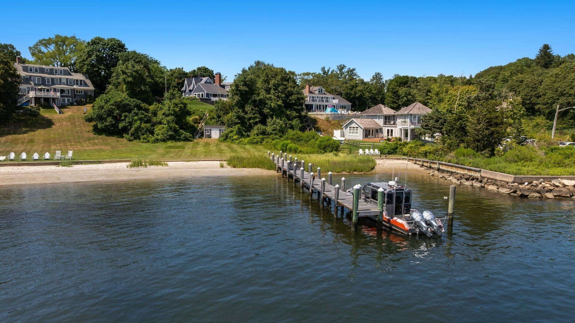 916 Main Street Cotuit, MA 02635 - Photo 4 of 22 a view of a lake with a city