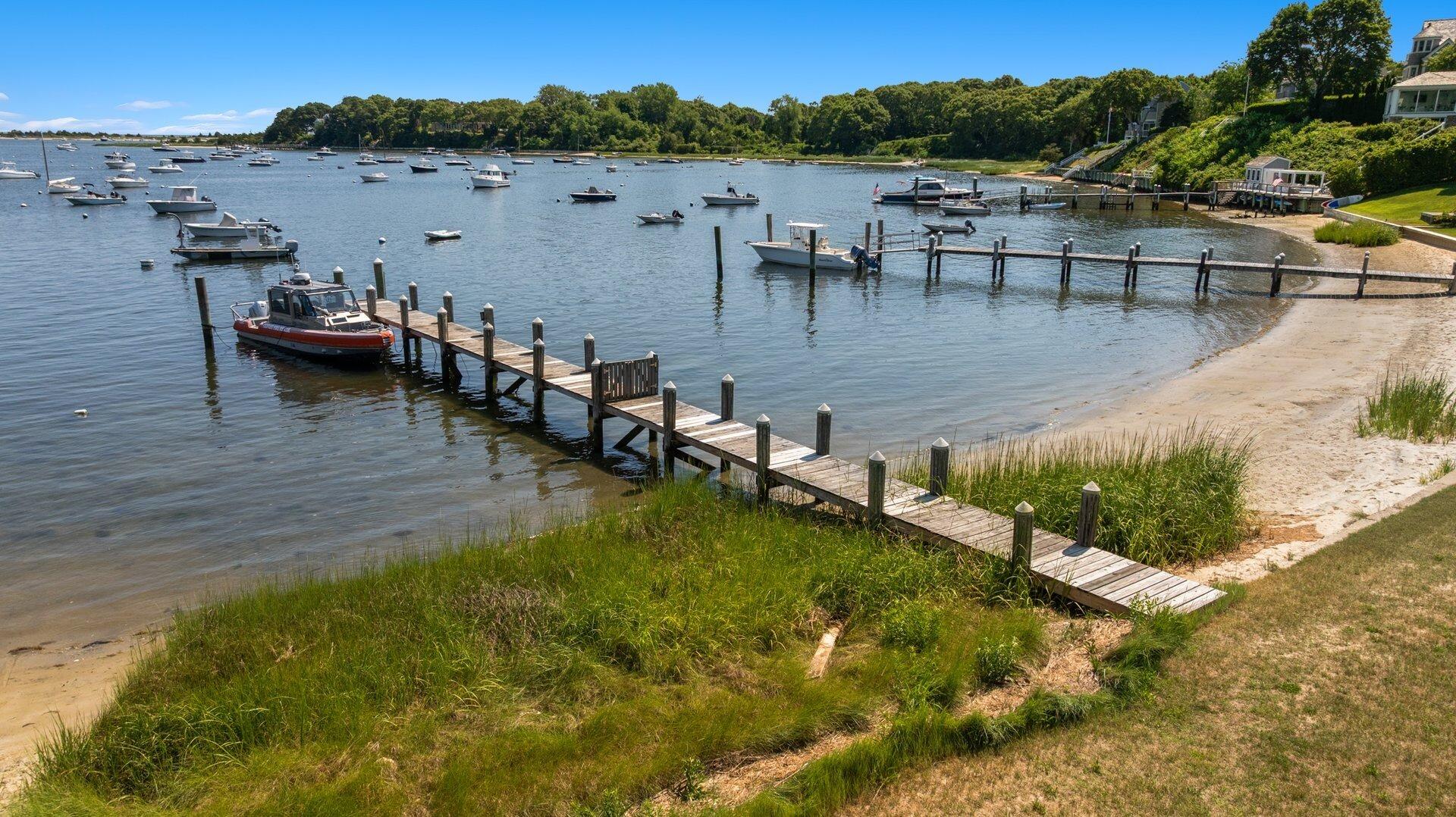 916 Main Street Cotuit, MA 02635 - Photo 5 of 22 a view of a lake with houses