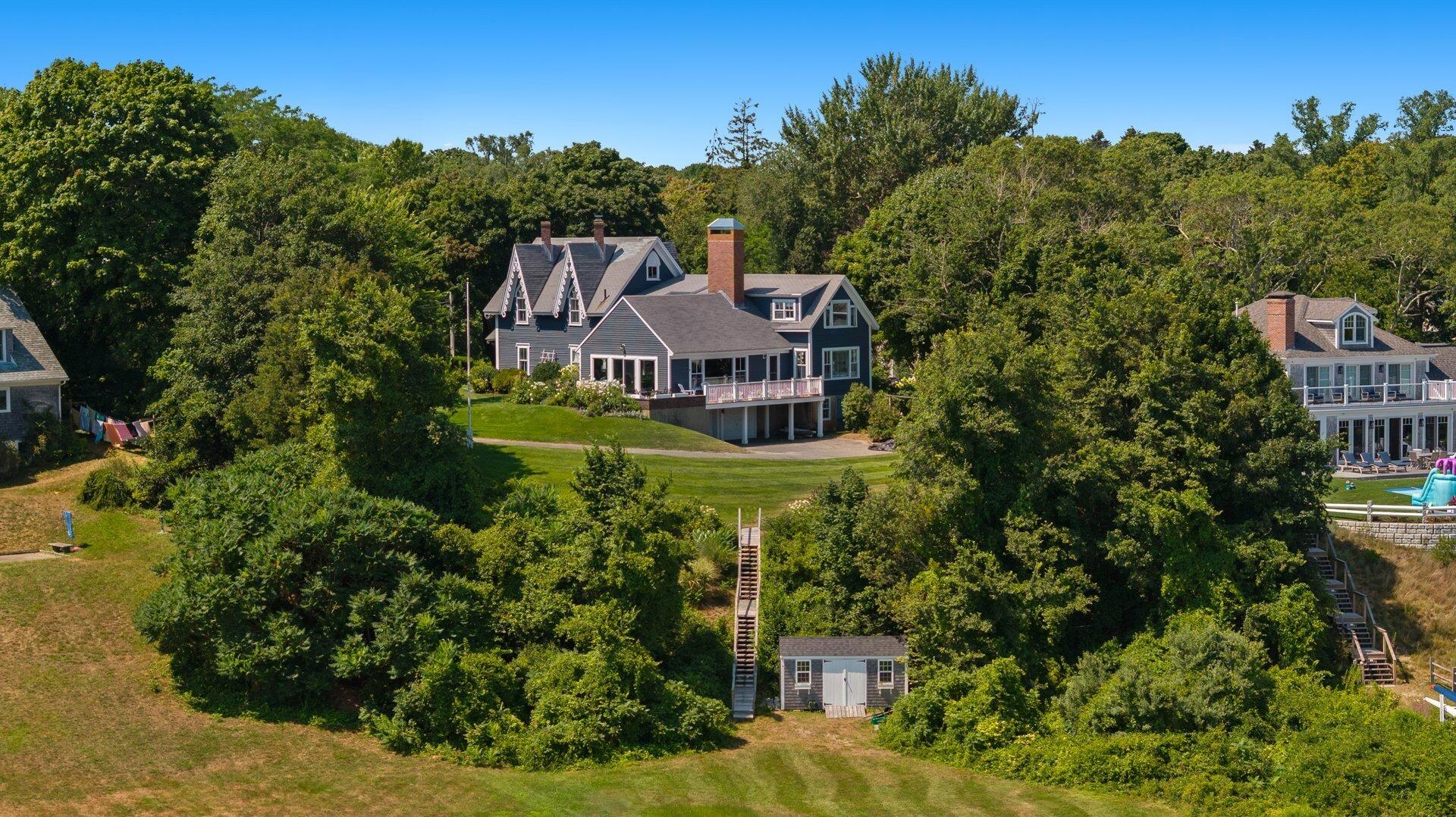 916 Main Street Cotuit, MA 02635 - Photo 6 of 22 a aerial view of a house with a garden and trees