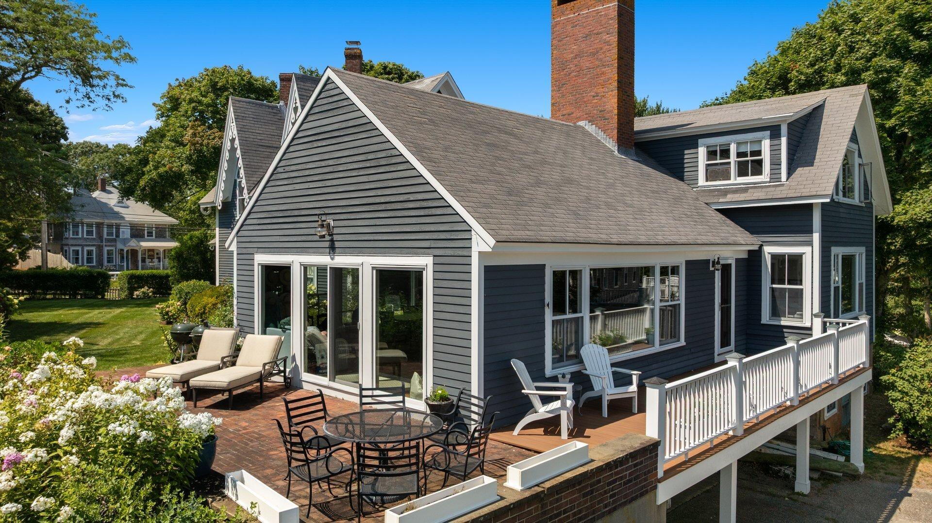 916 Main Street Cotuit, MA 02635 - Photo 7 of 22 a view of a house with backyard porch and sitting area