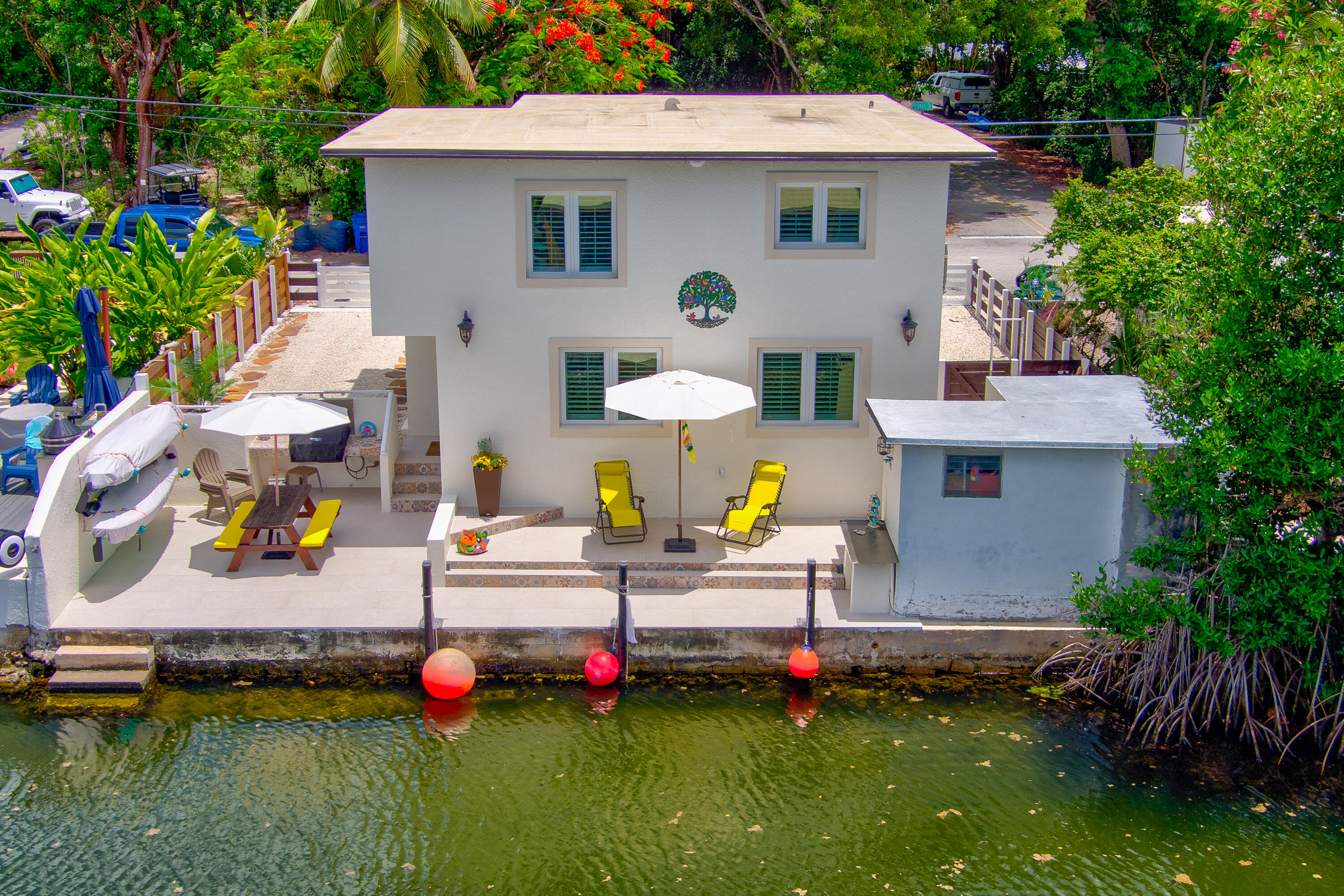 a view of a house with swimming pool and sitting area