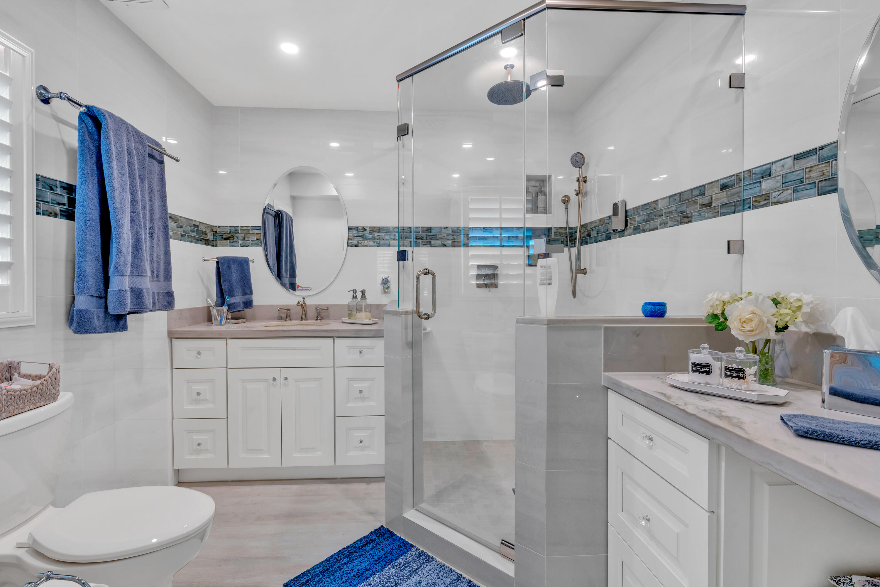 129 Pirates Drive Key Largo, FL 33037 - Photo 12 of 42 a spacious bathroom with a granite countertop sink a toilet a mirror and shower