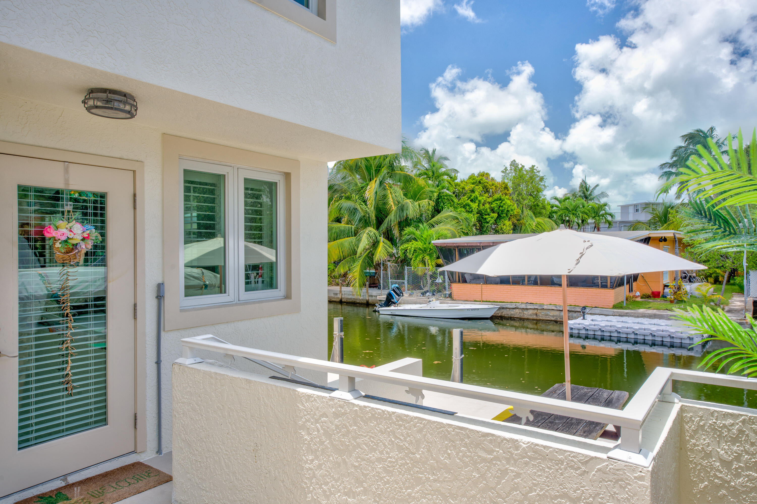 129 Pirates Drive Key Largo, FL 33037 - Photo 15 of 42 a view of a backyard with sitting area