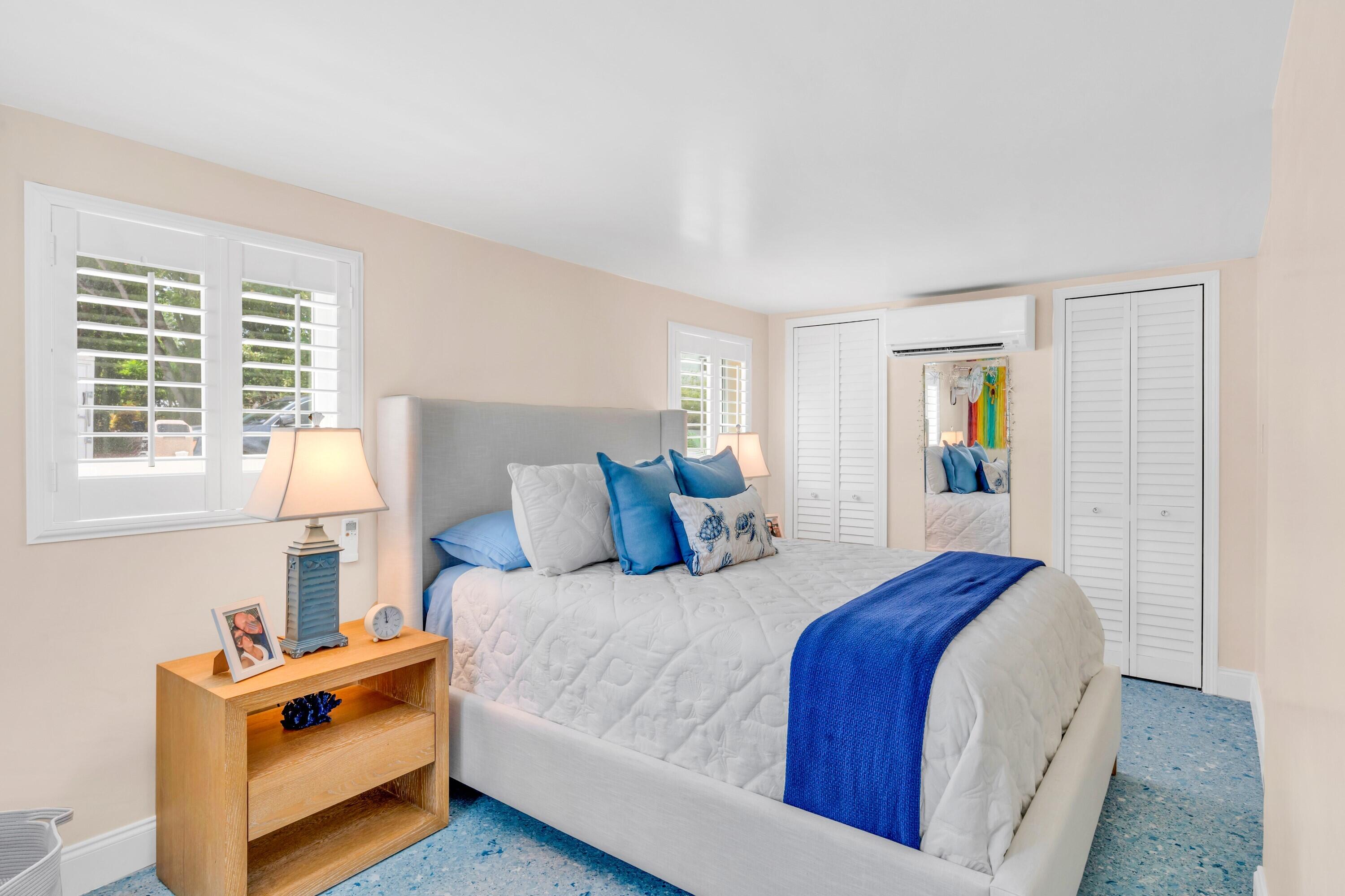 129 Pirates Drive Key Largo, FL 33037 - Photo 22 of 42 a bedroom with a bed and a window