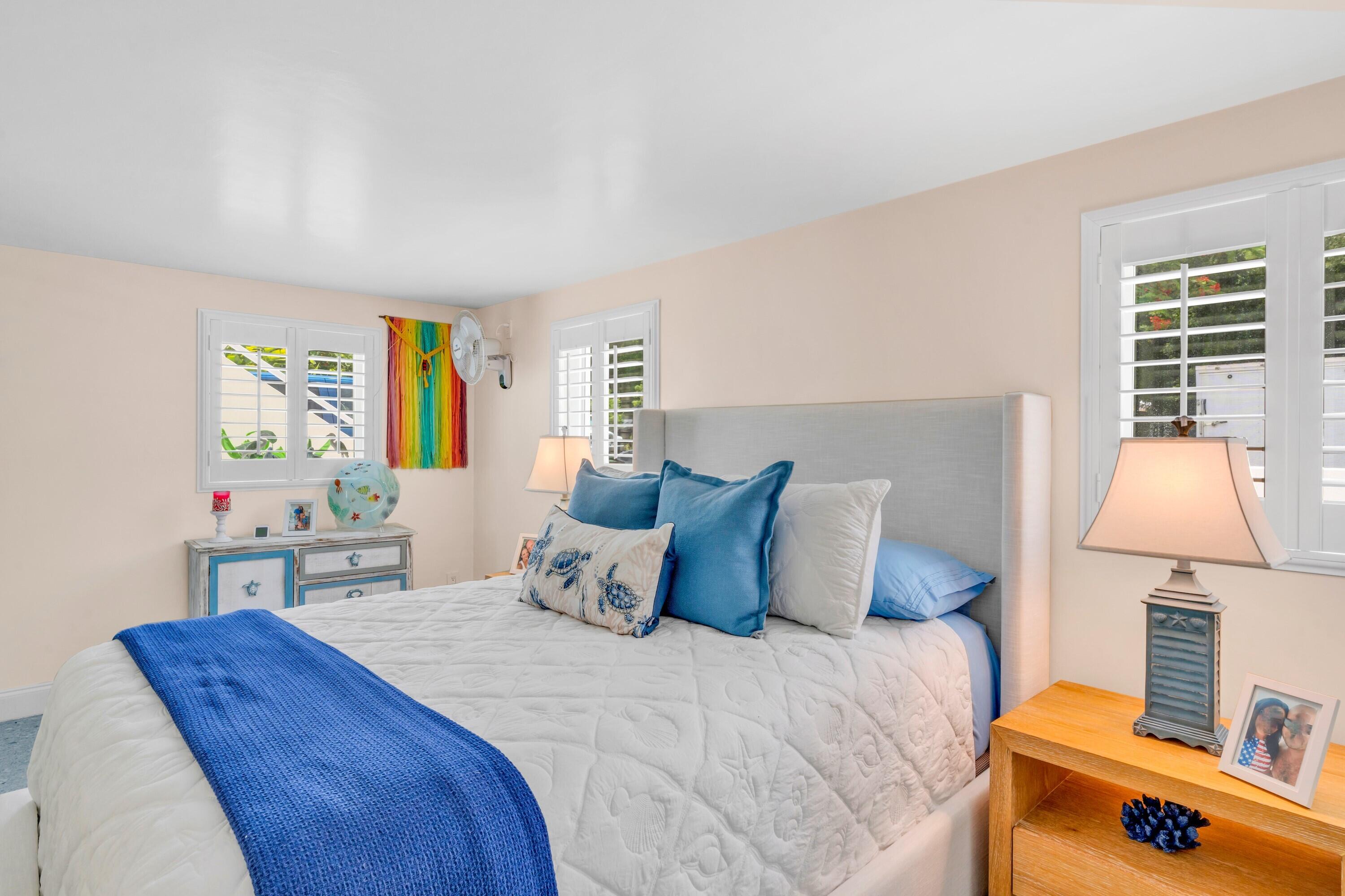 129 Pirates Drive Key Largo, FL 33037 - Photo 23 of 42 a bedroom with a bed and a window