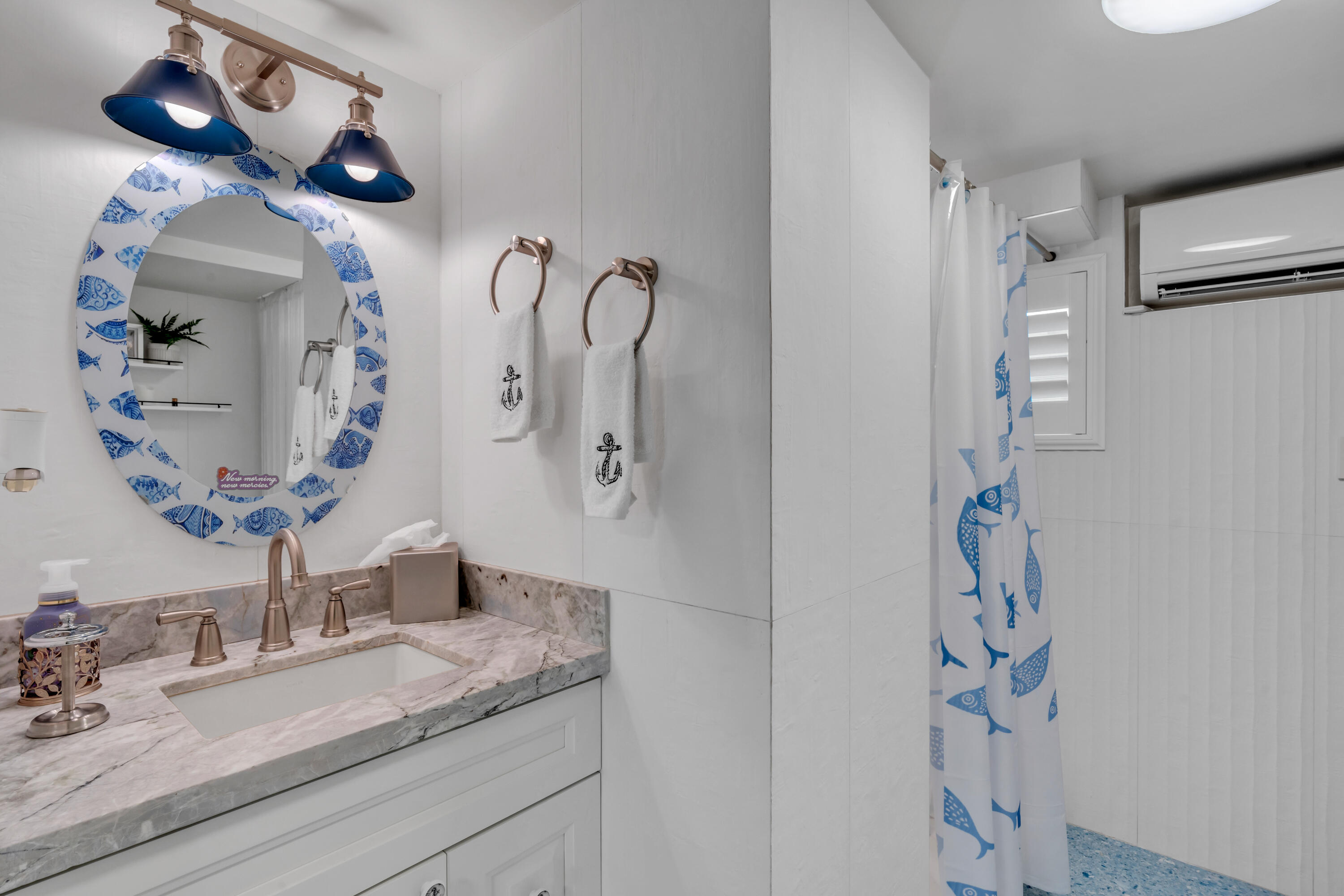 129 Pirates Drive Key Largo, FL 33037 - Photo 24 of 42 a bathroom with a sink and a mirror