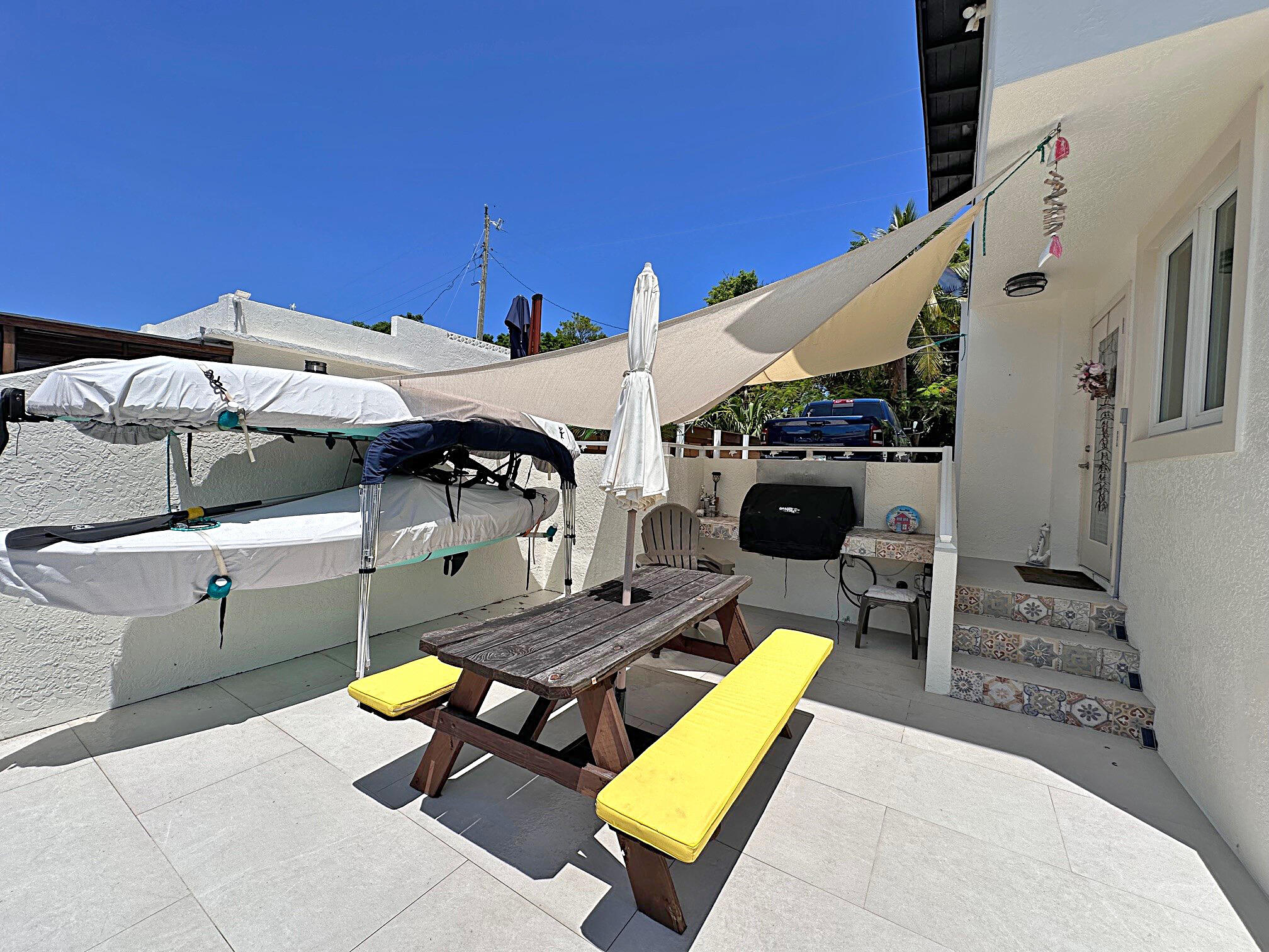 129 Pirates Drive Key Largo, FL 33037 - Photo 28 of 42 a view of a patio with a table and chairs