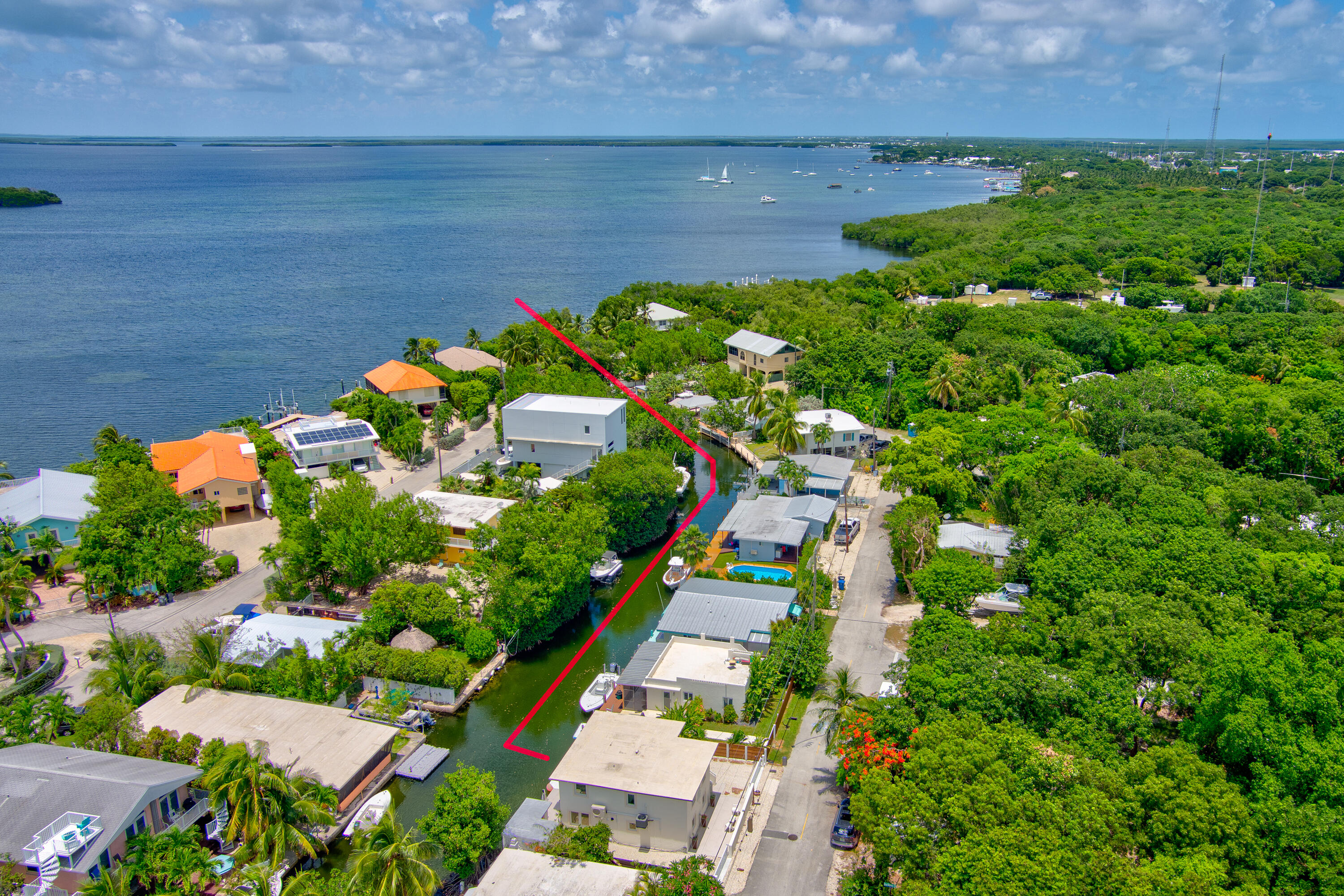 129 Pirates Drive Key Largo, FL 33037 - Photo 3 of 42 an aerial view of a house with a yard