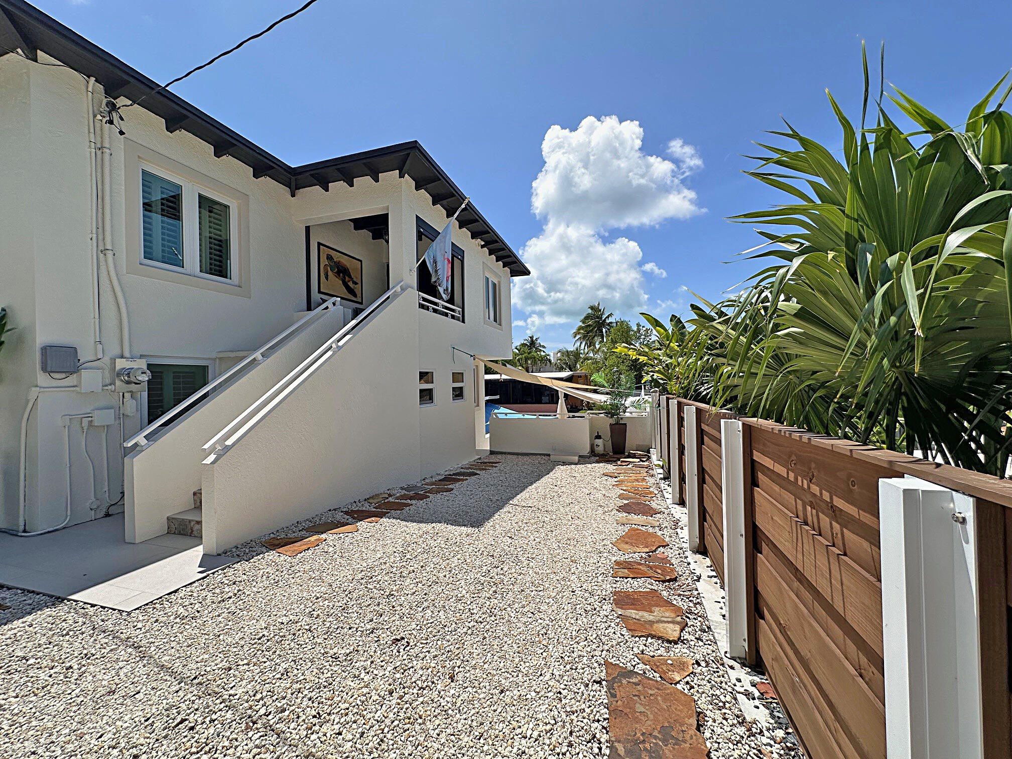129 Pirates Drive Key Largo, FL 33037 - Photo 33 of 42 a view of a house with a balcony