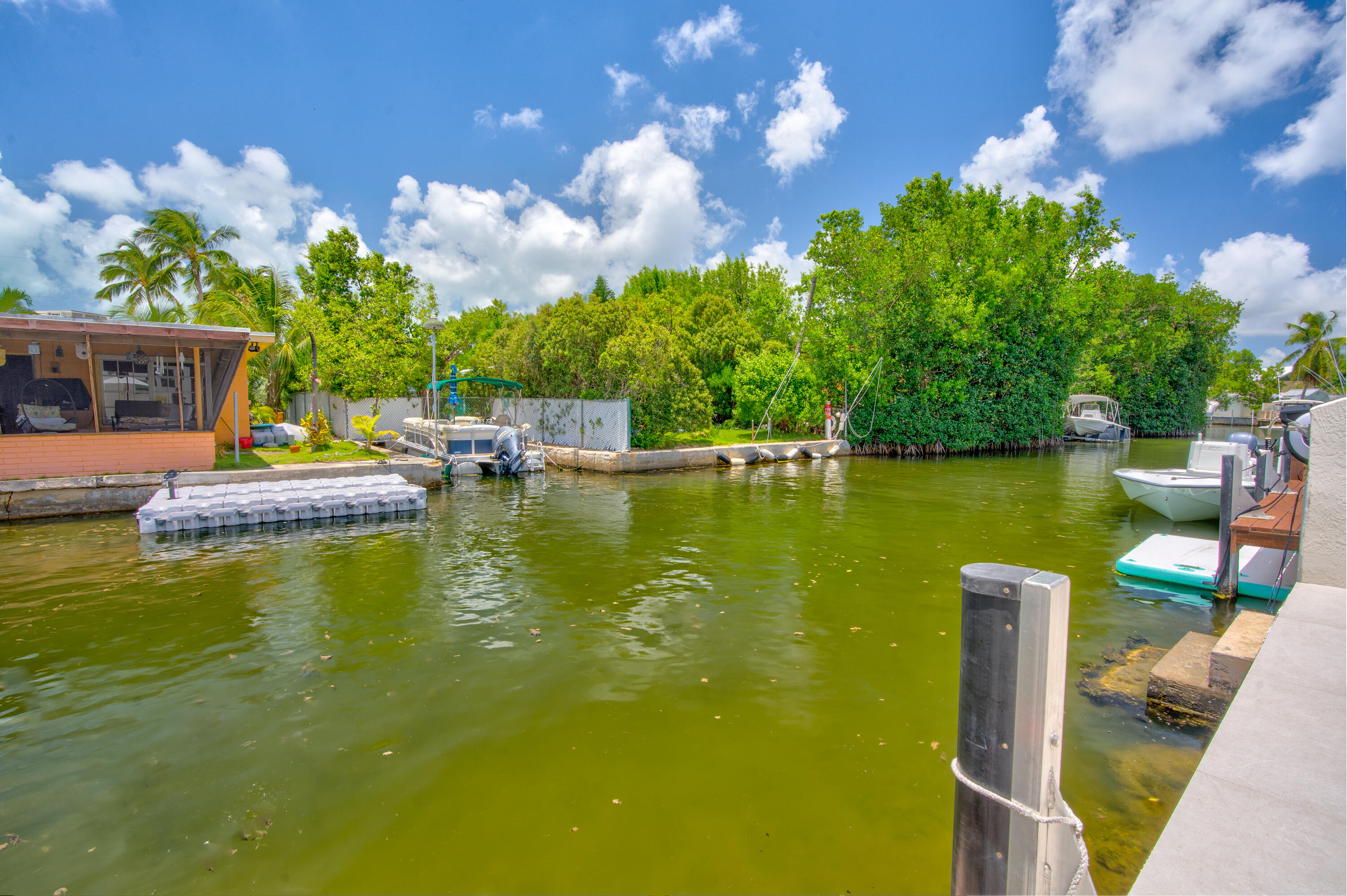 129 Pirates Drive Key Largo, FL 33037 - Photo 4 of 42 a view of a lake with a house swimming pool and outdoor space