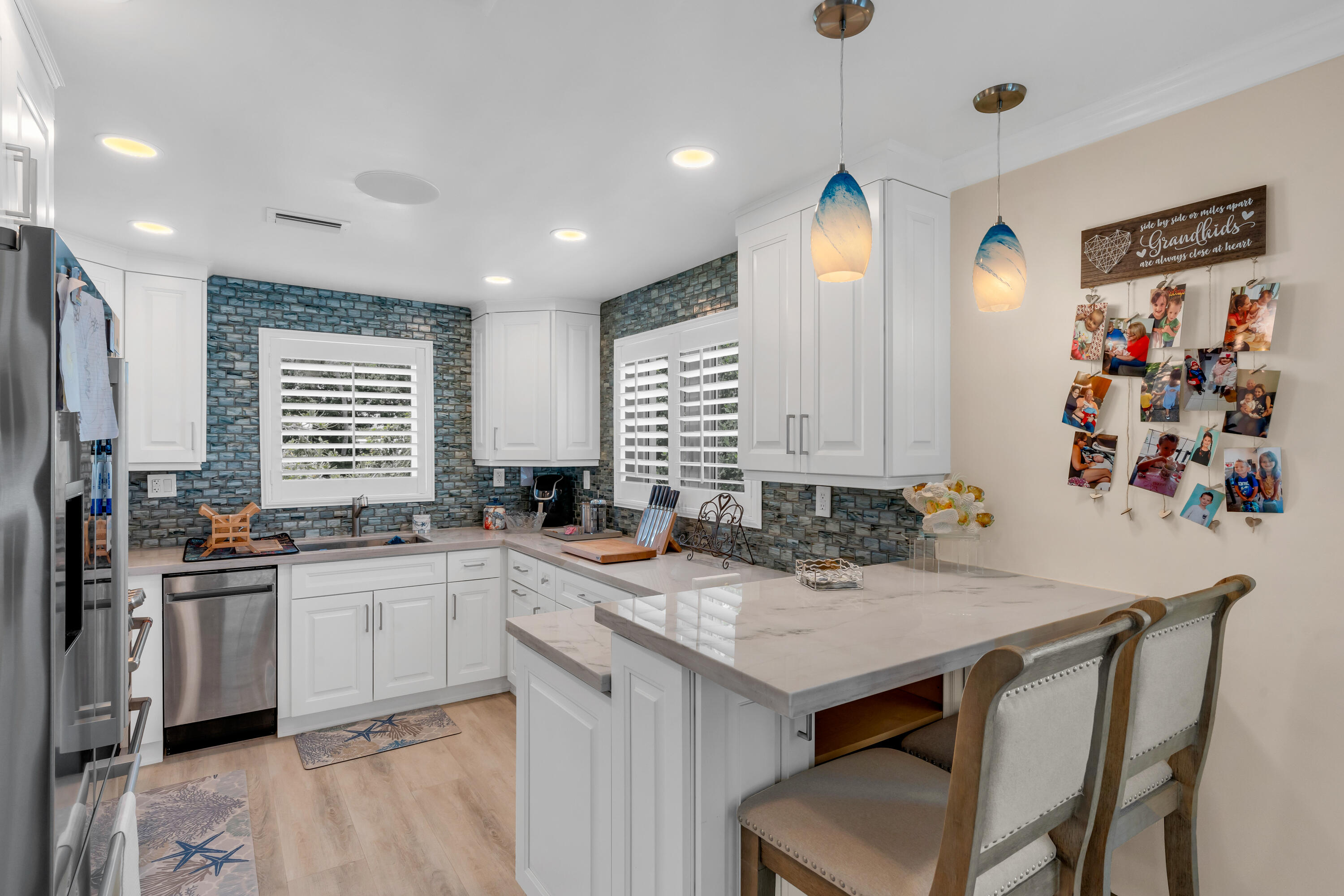 129 Pirates Drive Key Largo, FL 33037 - Photo 7 of 42 a kitchen with a sink a stove a refrigerator and a refrigerator