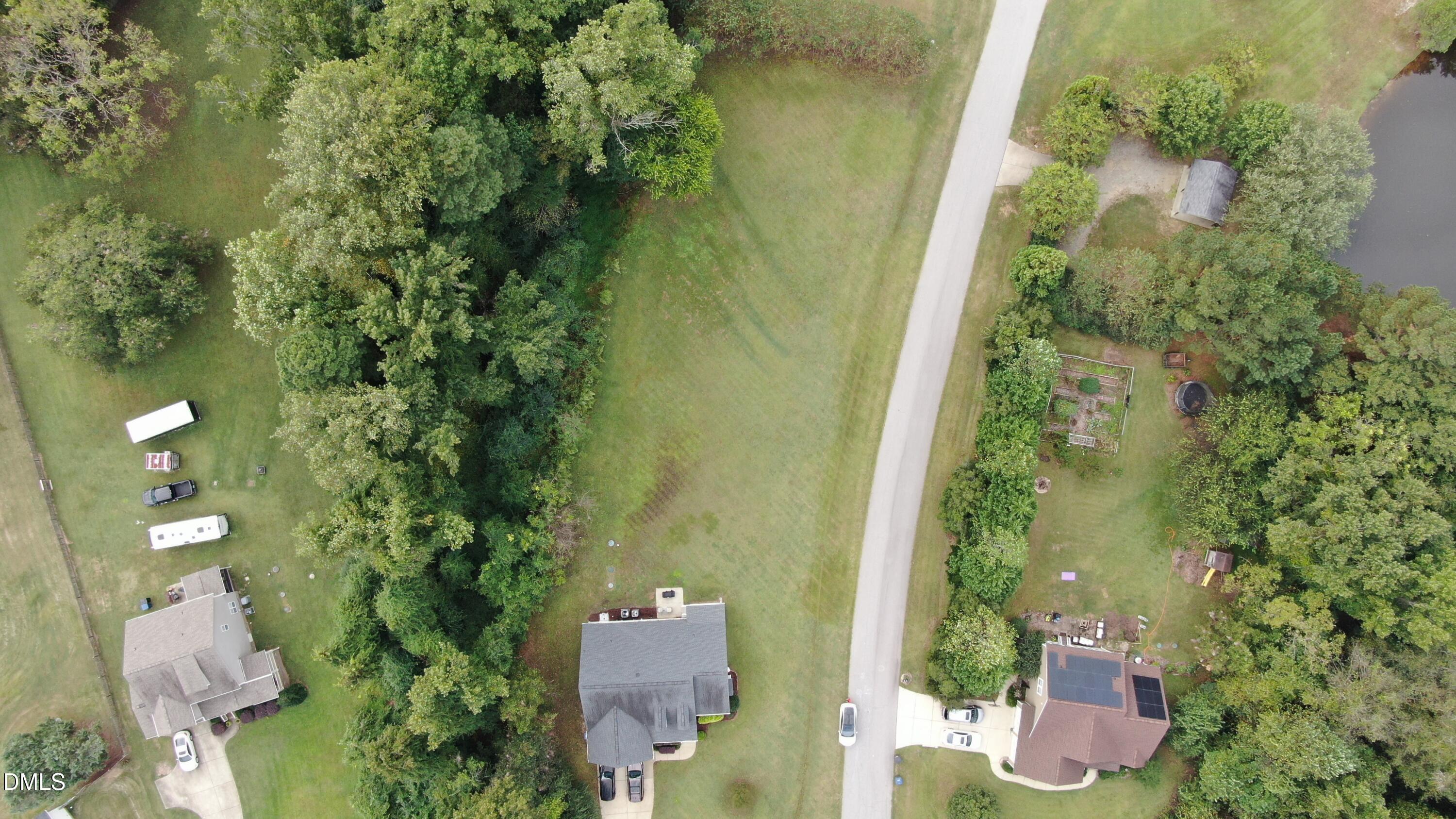 2426 Rolling Tracks Road Willow Spring, NC 27592 - Photo 2 of 41 an aerial view of residential house with outdoor space and trees all around