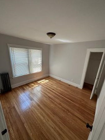 37-39 Fountain Street Springfield, MA 01108 - Photo 12 of 13 a view of an empty room with wooden floor and a window