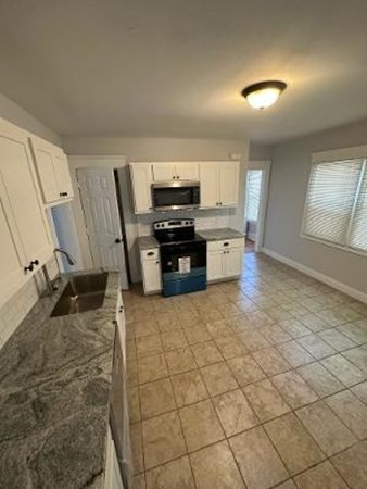 37-39 Fountain Street Springfield, MA 01108 - Photo 6 of 13 a kitchen with a sink and a stove top oven