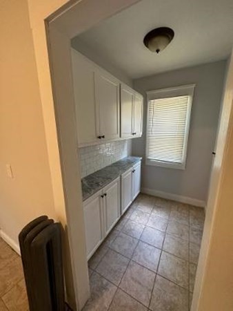 37-39 Fountain Street Springfield, MA 01108 - Photo 7 of 13 a kitchen with stainless steel appliances granite countertop a sink a stove a refrigerator a window