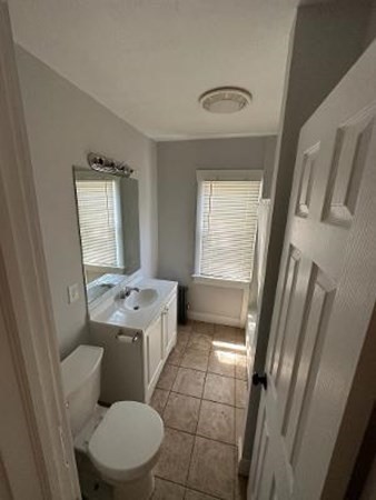 37-39 Fountain Street Springfield, MA 01108 - Photo 9 of 13 a bathroom with a toilet sink and mirror
