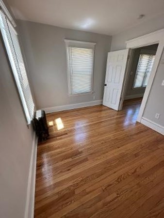37-39 Fountain Street Springfield, MA 01108 - Photo 10 of 13 wooden floor in an empty room with a window