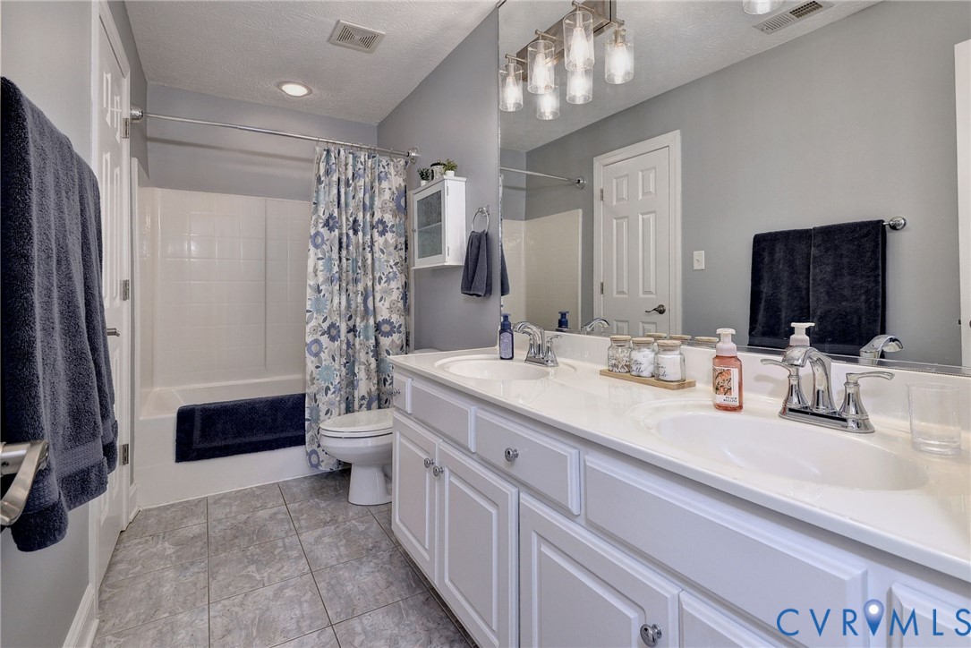 4015 Cold Spring Road Williamsburg, VA 23188 - Photo 32 of 57 Double vanity with integrated sinks, chrome fixtur