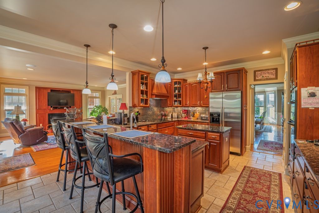 14319 Blunts Bridge Road Ashland, VA 23005 - Photo 13 of 50 Custom cherry cabinets, granite countertops, cente