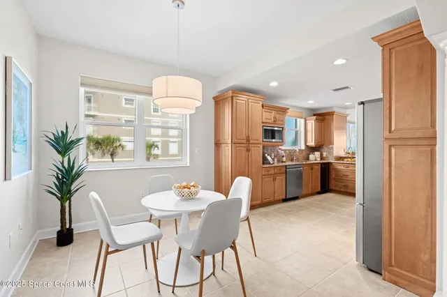 a spacious bathroom with a tub sink shower and mirror