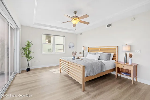 a large bathroom with a double vanity sink a large mirror and a bathtub