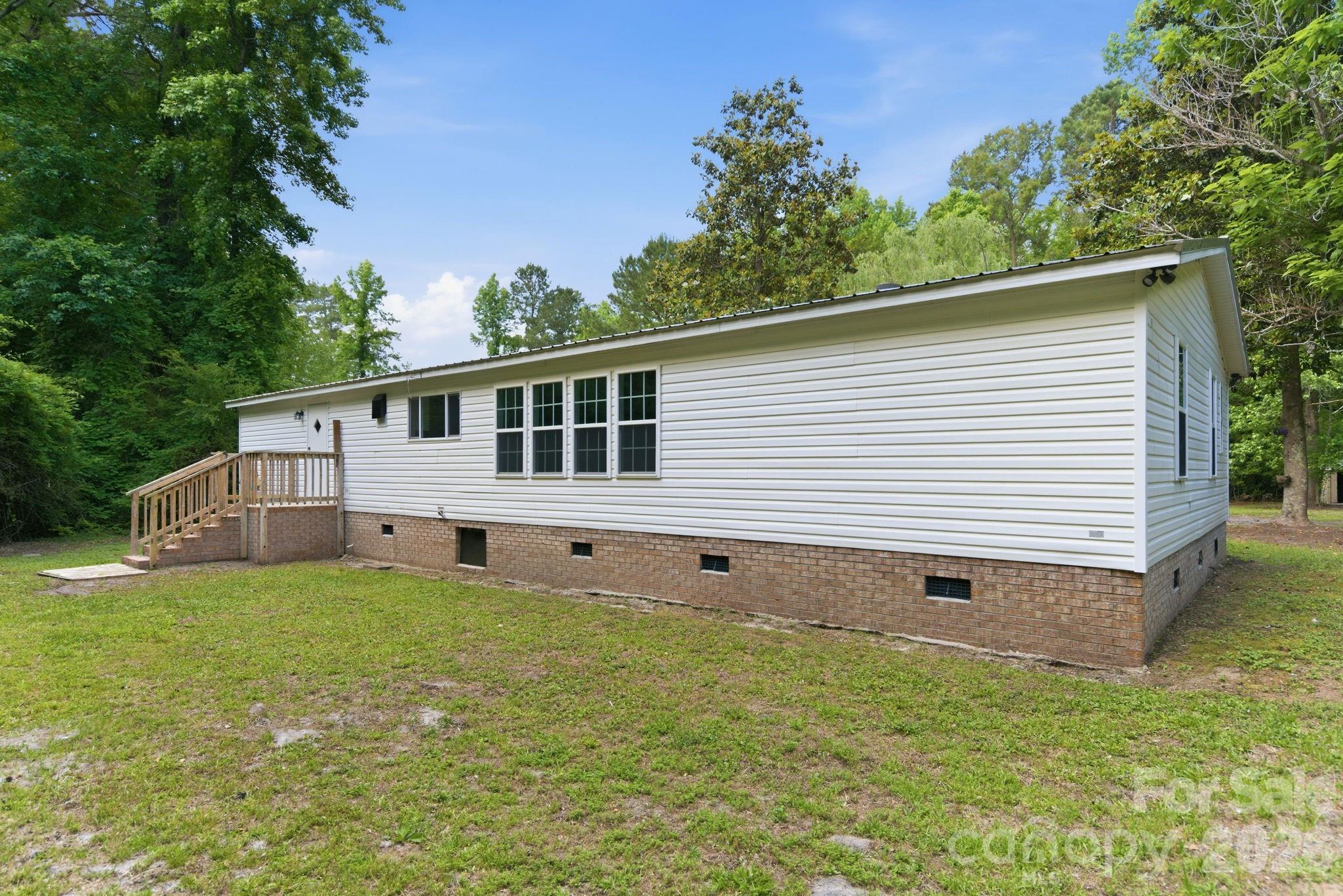 481 Harrell Road Burgaw, NC 28425 - Photo 17 of 25 a view of a house with a yard and sitting area