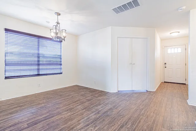 a kitchen with a sink a refrigerator and cabinets