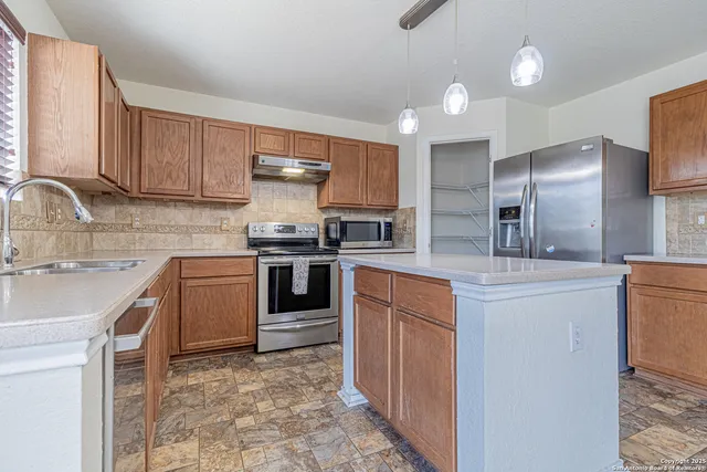 a view of entryway and hall with a fireplace