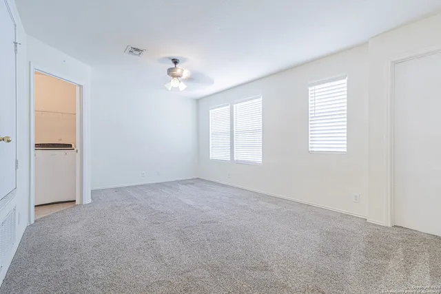 a view of empty room with windows