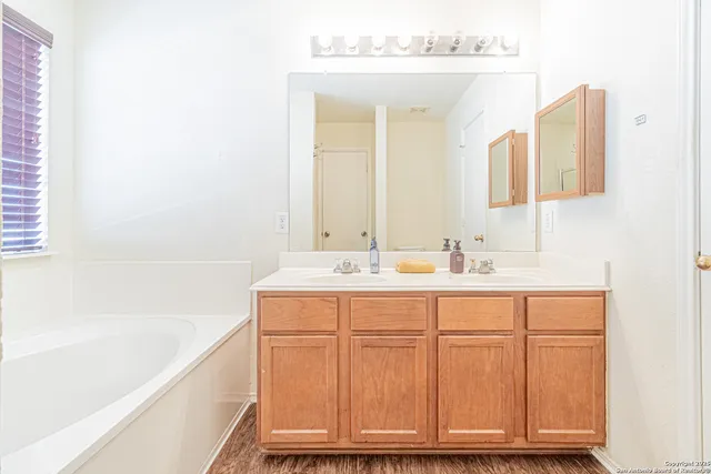a bathroom with a sink and a bathtub