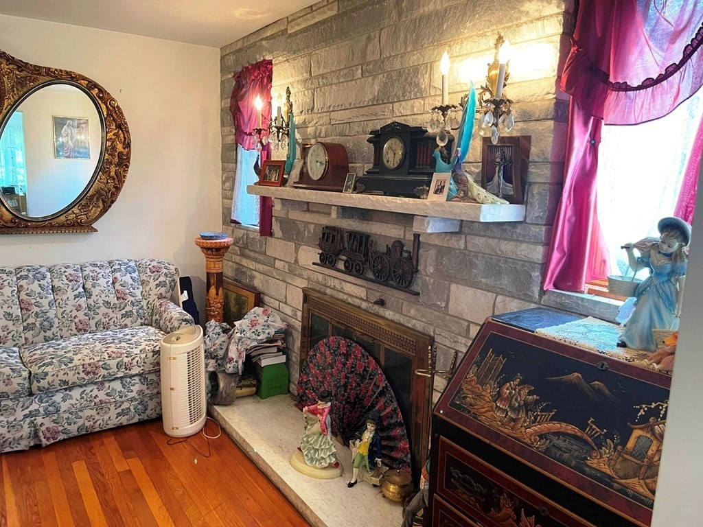 22 Maple Street Norton, MA 02766 - Photo 19 of 32 a living room with furniture and a fireplace