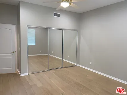 an empty room with fan