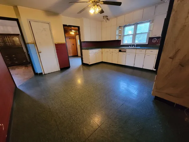 a kitchen with stainless steel appliances a refrigerator and a stove