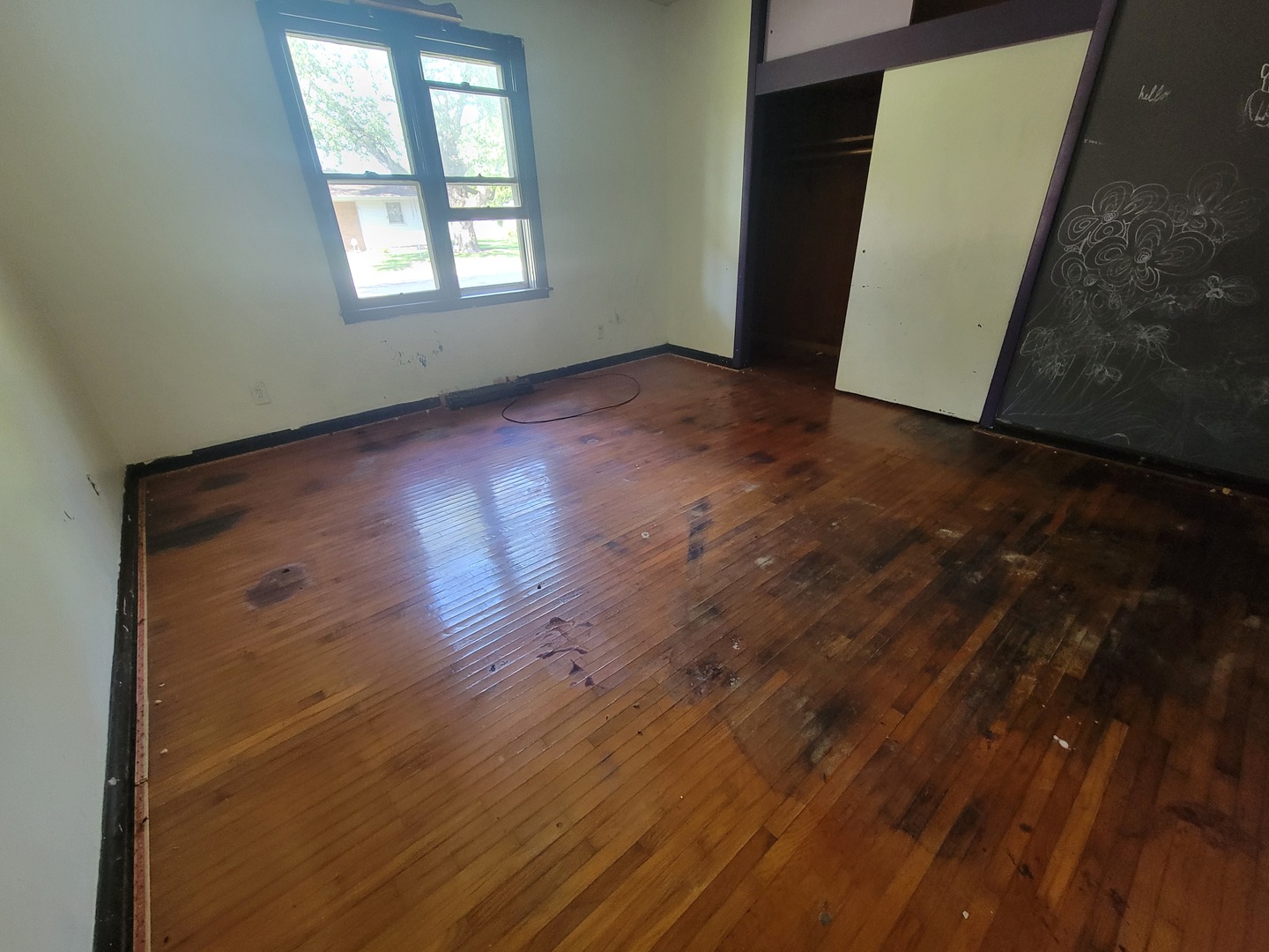 204 Williams Street Henry, IL 61537 - Photo 17 of 35 an empty room with wooden floor and windows