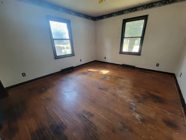 an empty room with windows
