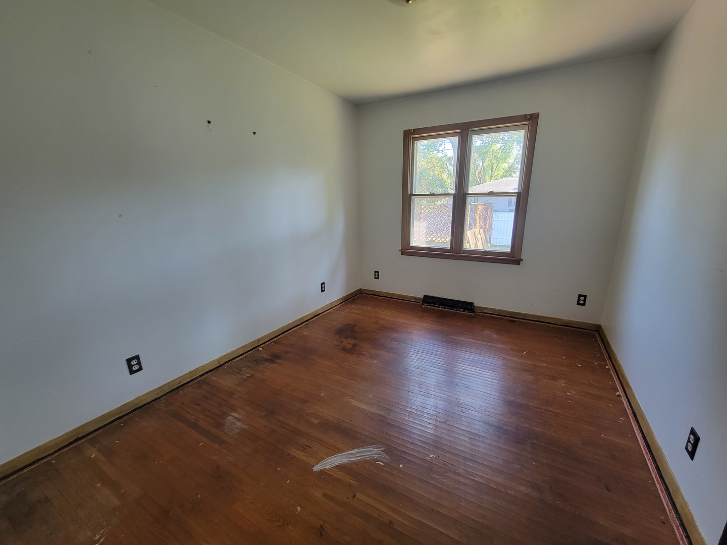 204 Williams Street Henry, IL 61537 - Photo 26 of 35 an empty room with wooden floor and windows
