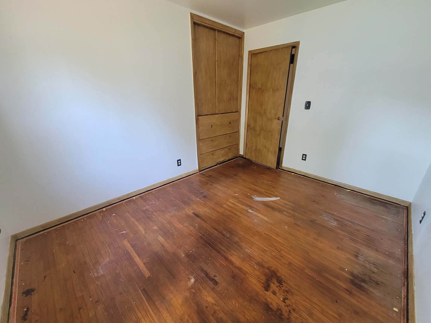 204 Williams Street Henry, IL 61537 - Photo 27 of 35 a view of an empty room with closet and wooden floor