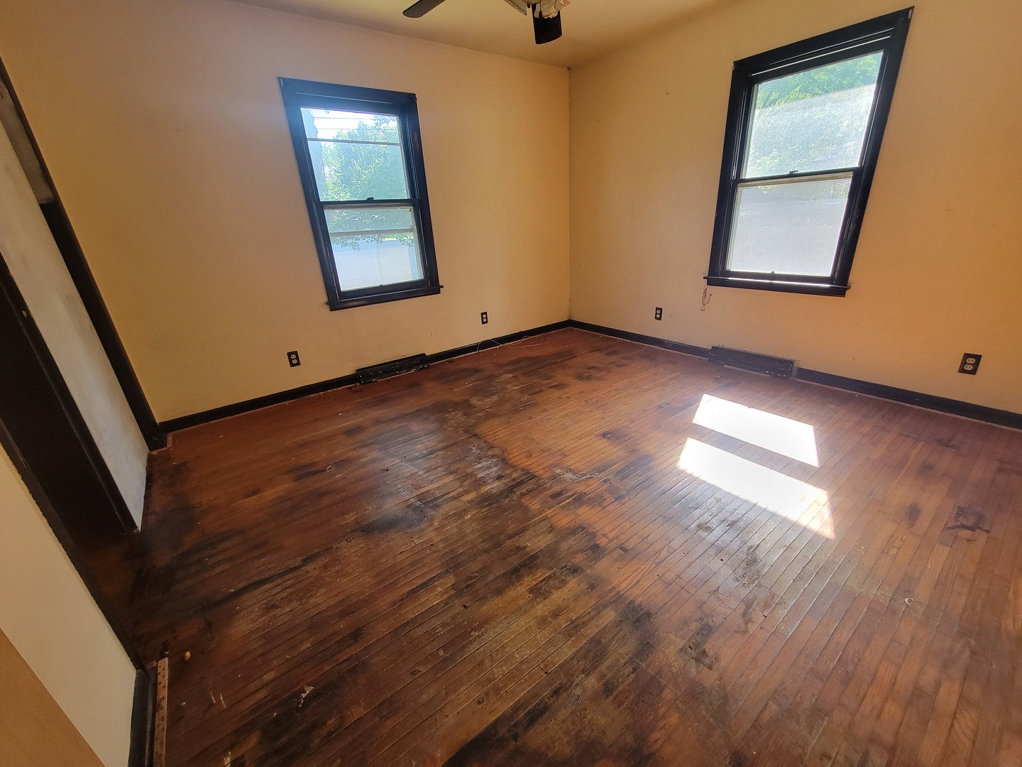 204 Williams Street Henry, IL 61537 - Photo 28 of 35 an empty room with wooden floor and windows