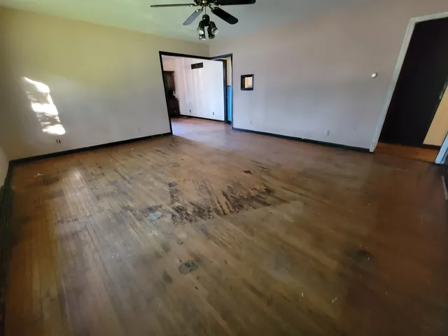 a view of a livingroom with a stove and a window
