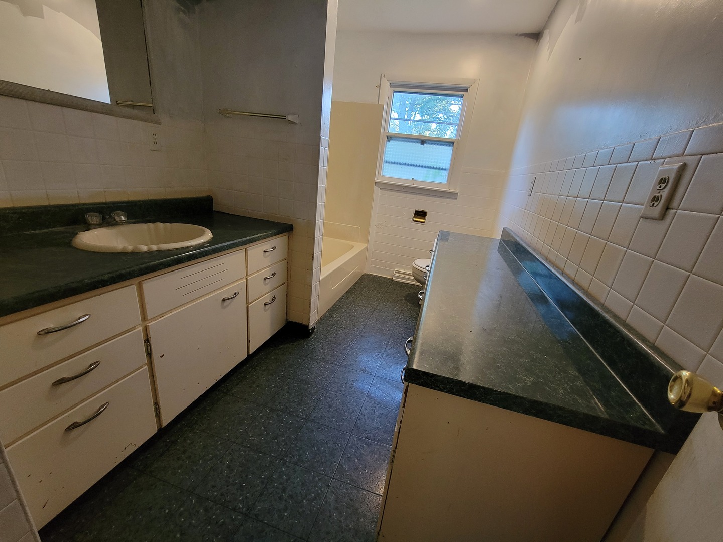 204 Williams Street Henry, IL 61537 - Photo 9 of 35 a view of an empty room with wooden floor and a window