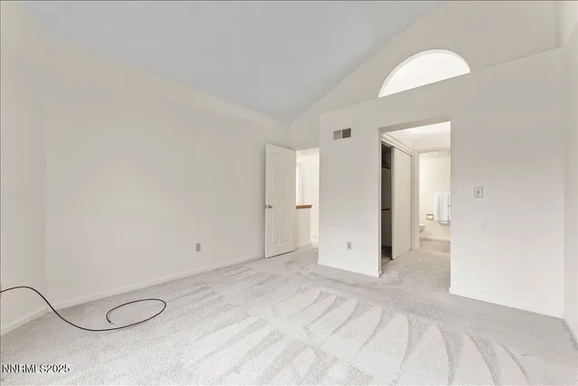 a view of a backyard with a large tree