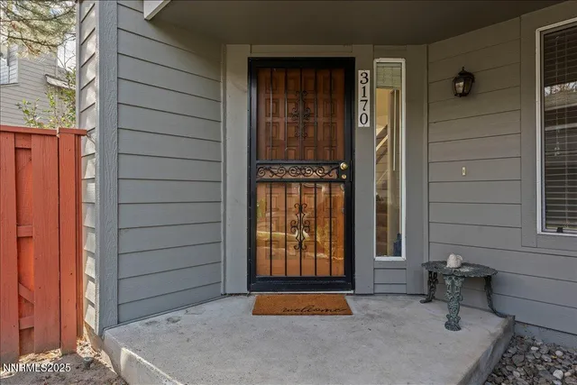 a view of a livingroom with an empty space and a fireplace
