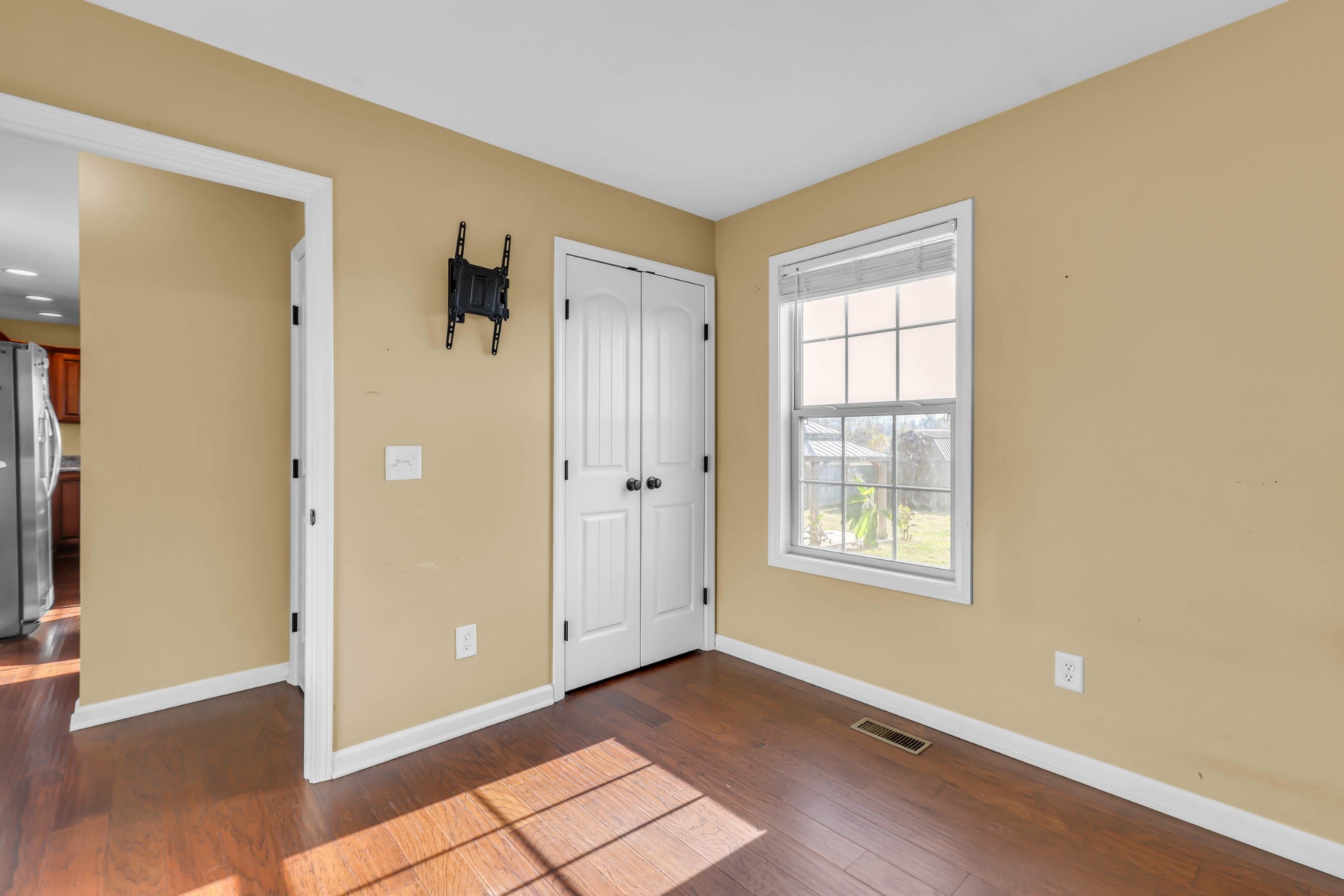 150 B T G T Road Portland, TN 37148 - Photo 11 of 20 a view of an empty room with window and wooden floor